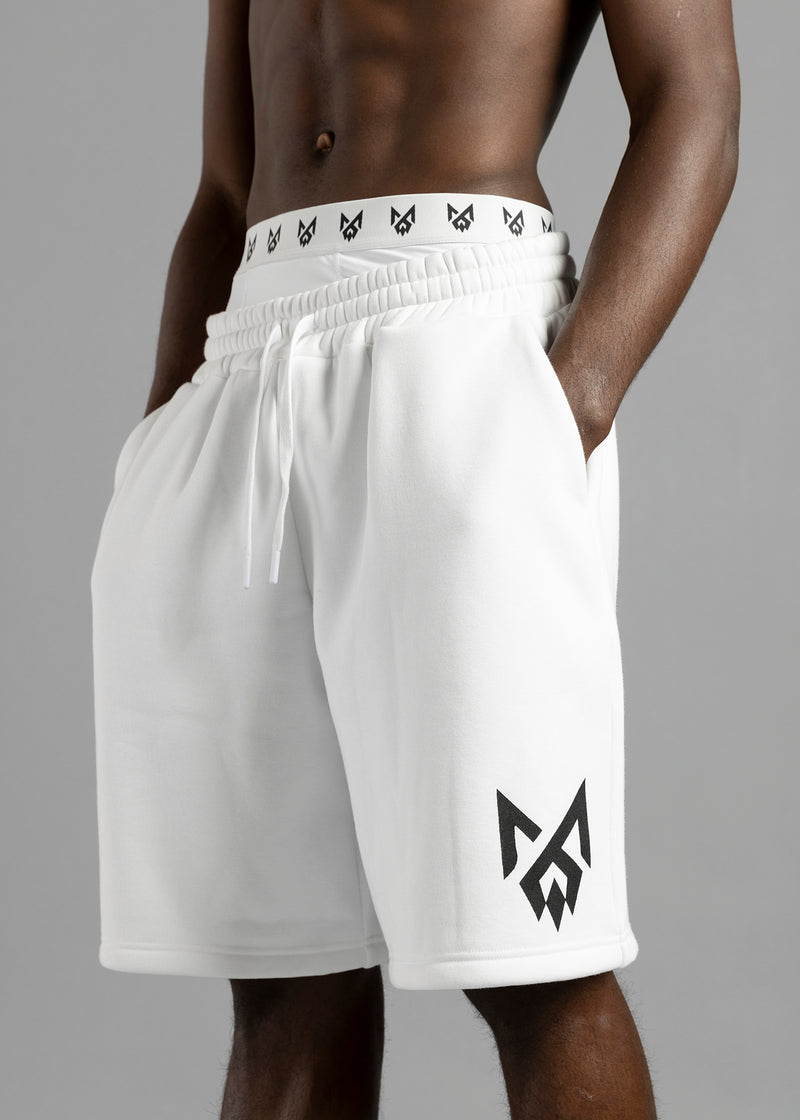 Close-up of MilkWhite Jogger Shorts on a model, showing the gathered waistband, drawstrings, side pockets and black leg logo.