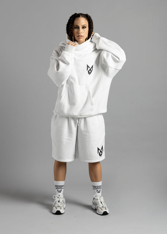 Model wearing signature white Rosebud hoodie with turtleneck hood and the Milkwhite Apparel logo on the left breast, paired with MilkWhite white shorts and MW Socks