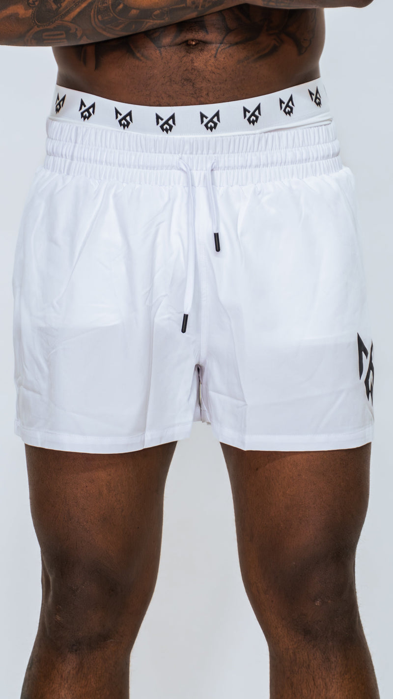 Closeup of Milkwhite short swim trunks showcasing fabric materials and quality.