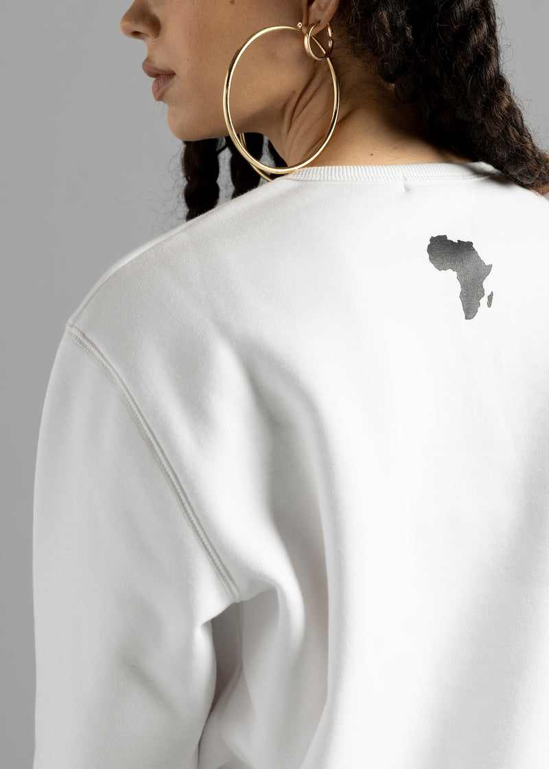 Rear close-up of the white Milk Essential Sweatshirt by MilkWhite, showing the dark Africa-shaped graphic beneath the ribbed neckline.